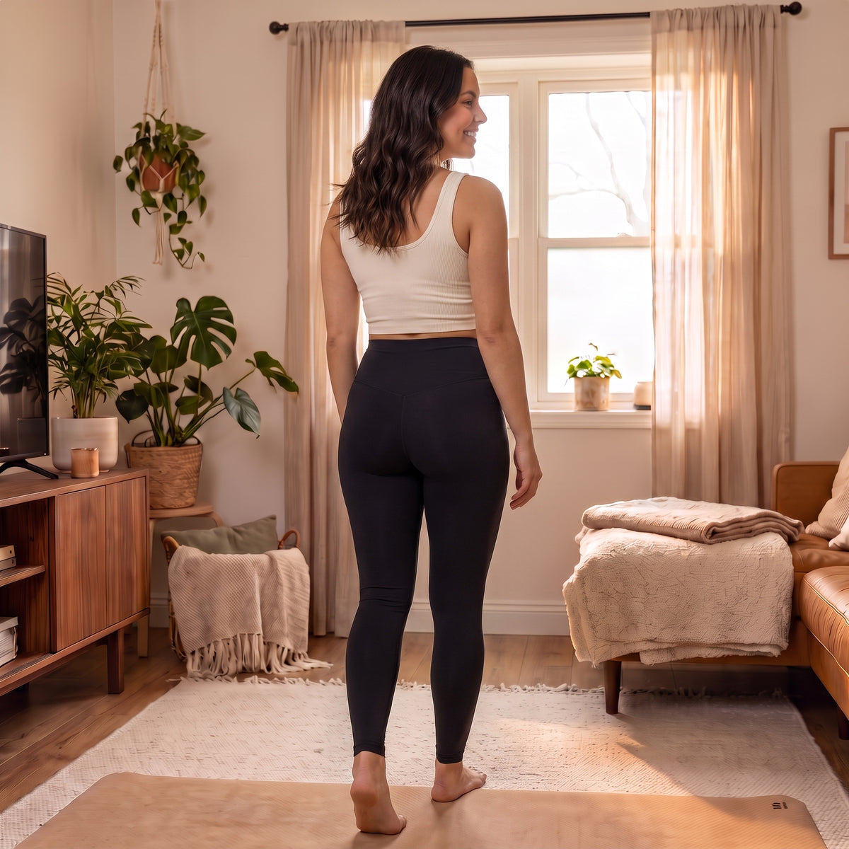 UGC model wearing High-Waist Yoga Leggings in Black, back view