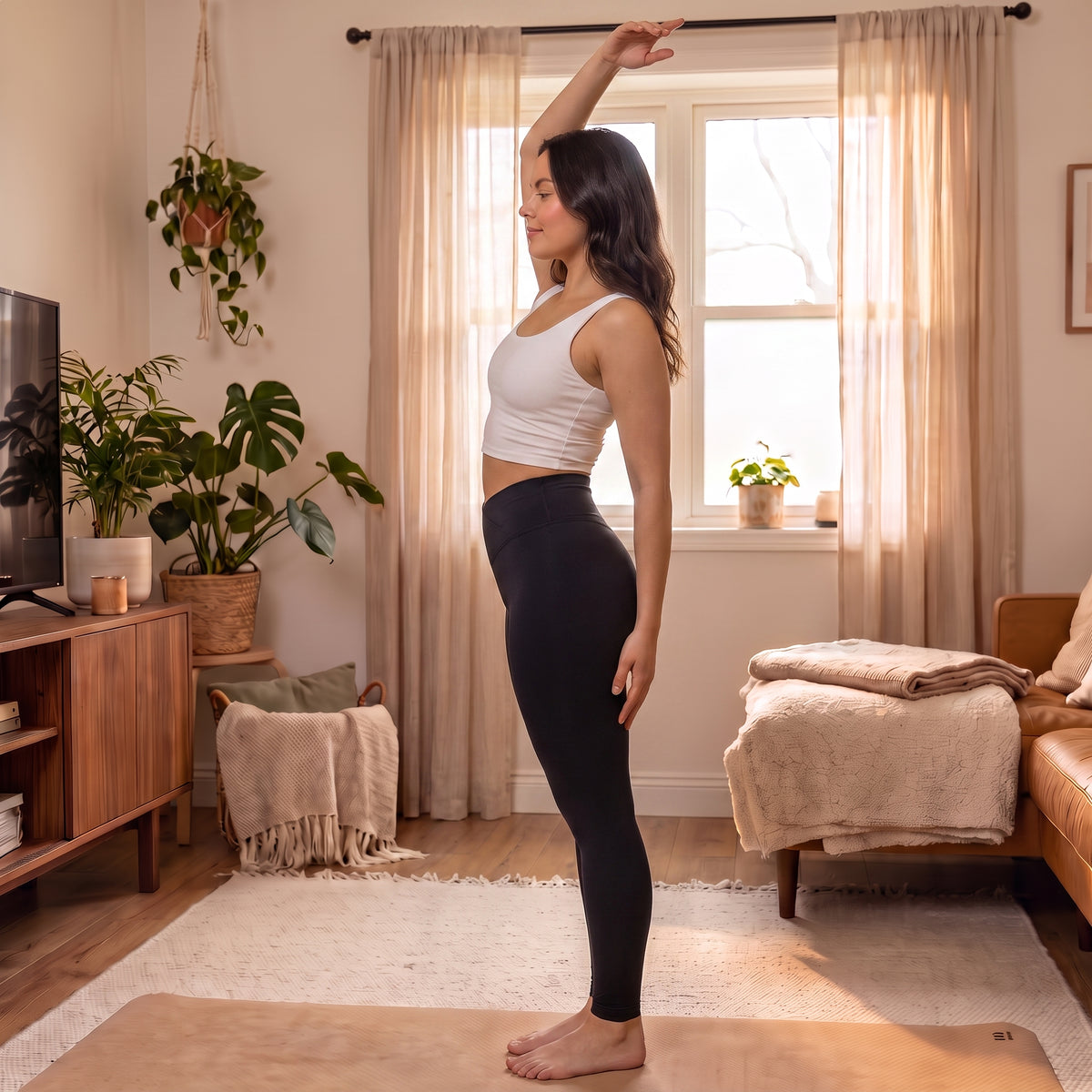 UGC model wearing High-Waist Yoga Leggings in Black, side view