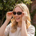 Ingvild wearing the Black Frameless Rectangular Sunglasses outdoors