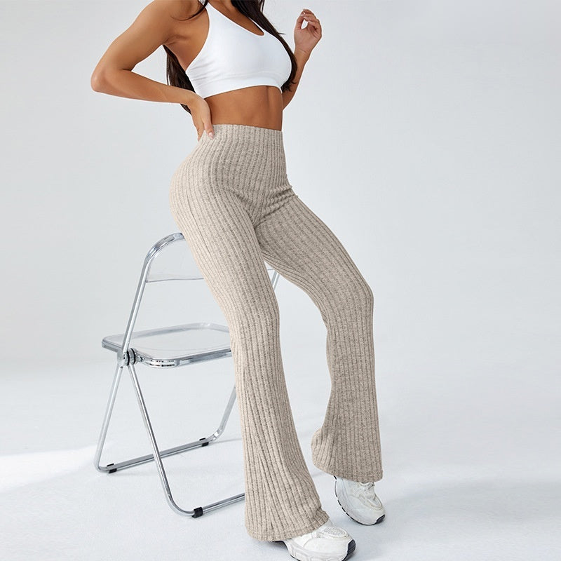 Ribbed flare yoga pants in beige, seated styling